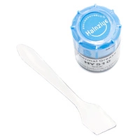 Słoik z pastą termoprzewodzącą i aplikator